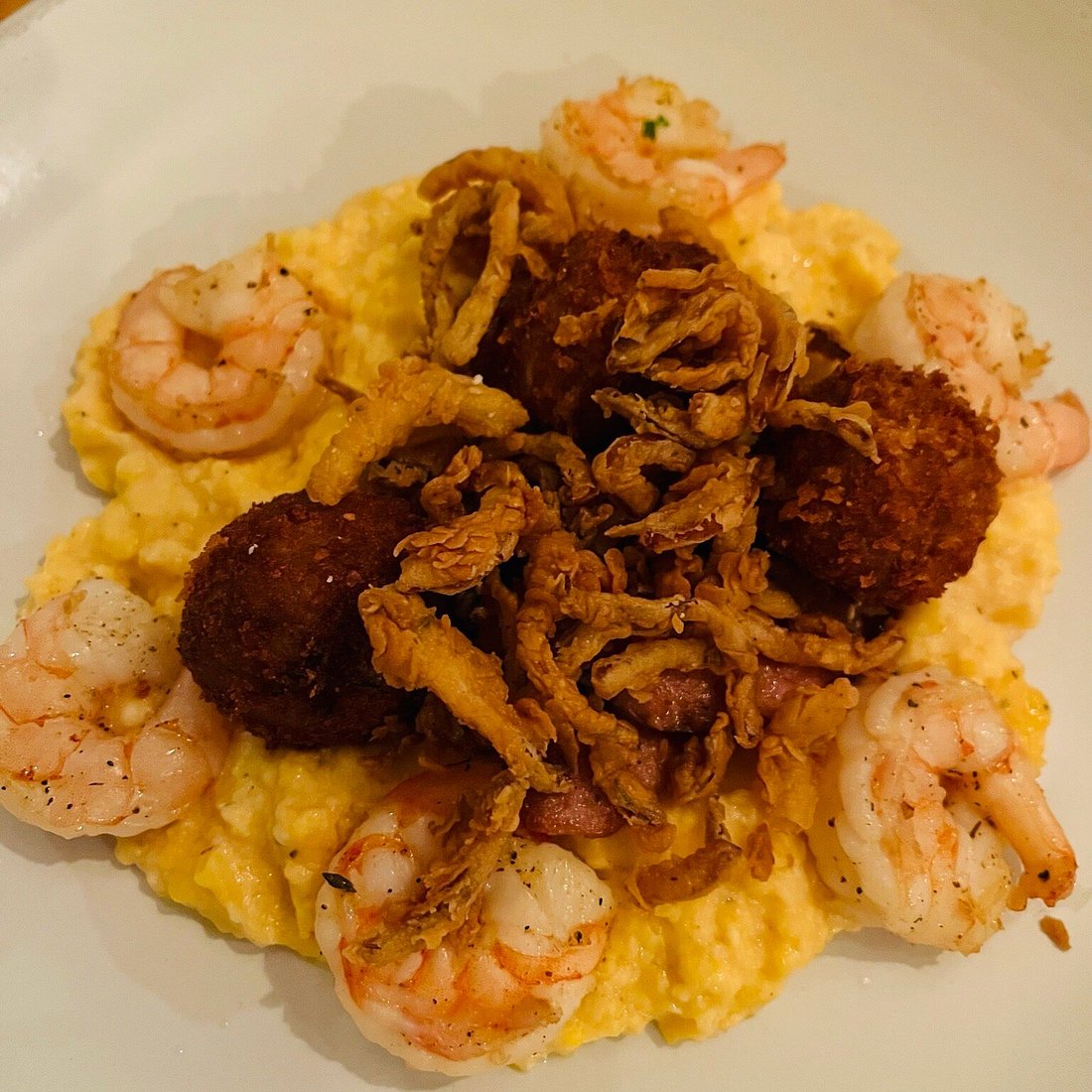 Backwoods Crossing signature dishes Shrimp and GritsCrab CakesFried Green TomatoesSeasonal Farm-to-Table Specials